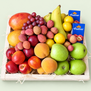 Fresh seasonal fruit and two juice cartons in a wooden gift tray from Eros Florist in Pretoria