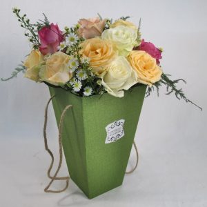 rainbow roses in gift vase