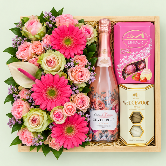 Rosy Celebration flower and bubbly gift tray from Eros Florist. Includes Annabelle Sparkling Wine, with a Pongrácz upgrade available.