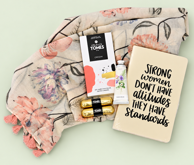 Strong Women gift hamper with a floral scarf, notebook, hand cream and Tomes chocolates in a silver container with a bow