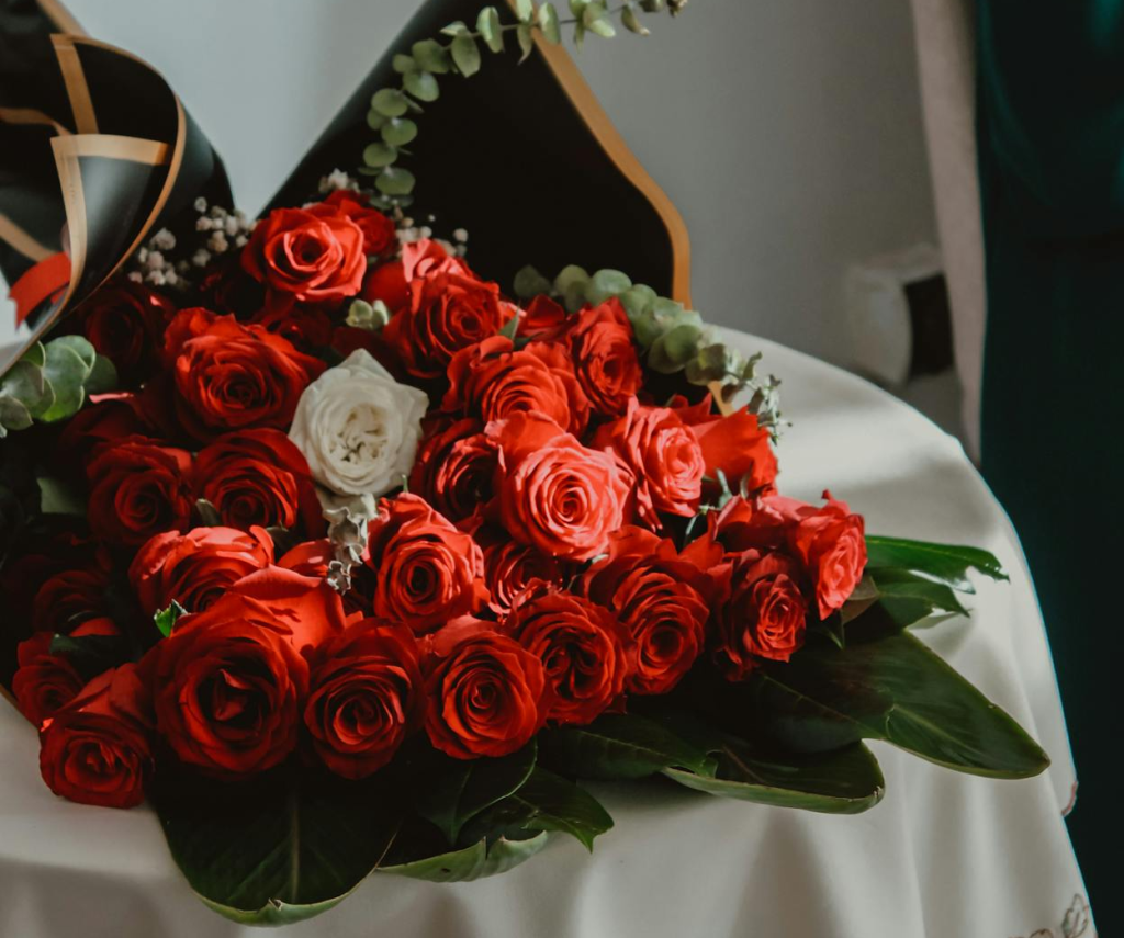 A custom rose bouquet with a single white rose