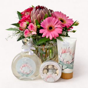 Protea flower and fragrance gift set with gerberas roses and body care products