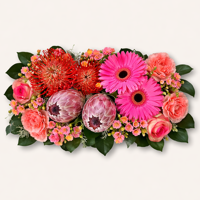 Protea flower crate arrangement with gerberas and roses by Pretoria florist