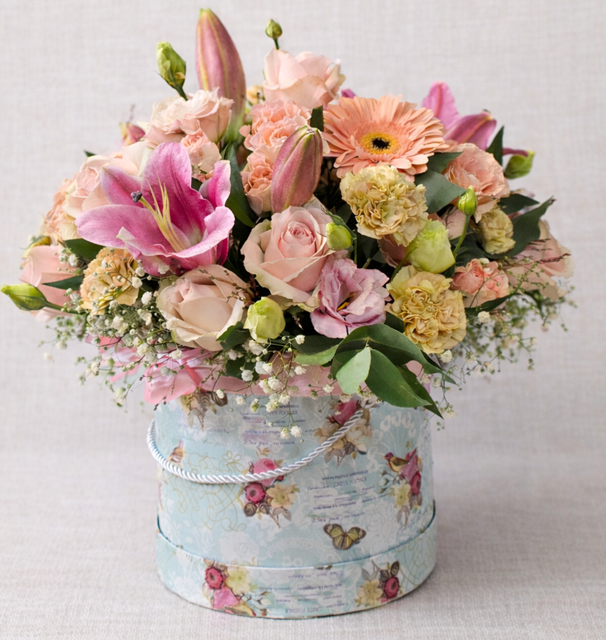 Pastel seasonal hatbox flower arrangement with roses lilies and gerbera – Pretoria flower delivery
