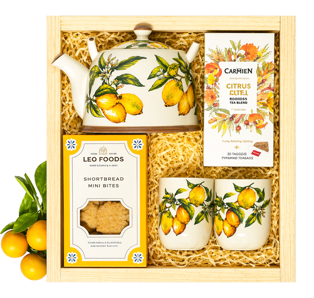 An elegant oriental tea gift set presented in a wooden crate, featuring a ceramic teapot, small matching cups, citrus tea, and shortbread biscuits. A thoughtful and lasting gift, available for same-day delivery in Pretoria.