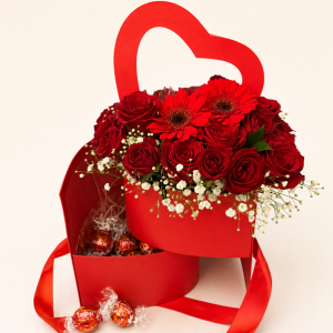 A romantic combination of fresh flowers and twelve assorted Lindt Lindor chocolates, beautifully presented in a heart-shaped gift box.