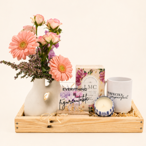 Bloom & Breathe Gift Crate featuring fresh pastel flowers, LMC Rose & Vanilla tea, a candle, an inspirational keepsake and a contemporary ceramic vase.