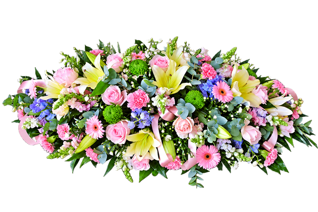 Pink and white oval funeral wreath made with seasonal flowers