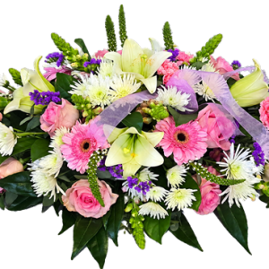 Pink and white oval funeral wreath made with seasonal flowers
