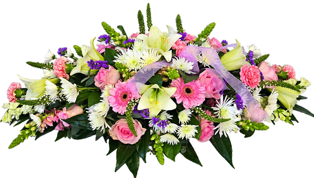 Pink and white oval funeral wreath made with seasonal flowers