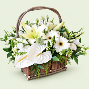 Serene Moments white lilies, anthuriums and gerberas in a rustic wooden basket