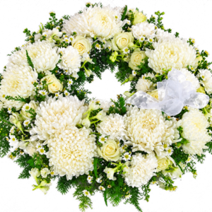 White Grace Sympathy Wreath with white seasonal flowers, greenery and a white organza bow
