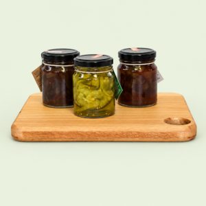Mini wooden charcuterie board with sticky onion marmalade, Sauvignon Blanc conserve and cucumber ribbons